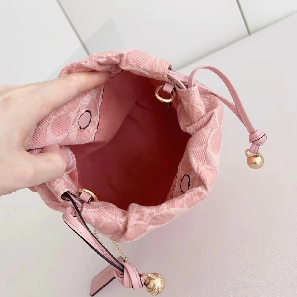 Coach Pink Signature Jacquard Mini Bucket Drawstring Crossbody Bag